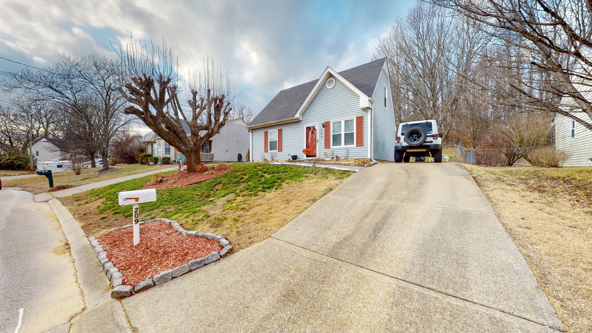 209 Dockside Court Hermitage, TN 37076 - Photo 25 of 43 a front view of a house with a yard and garage