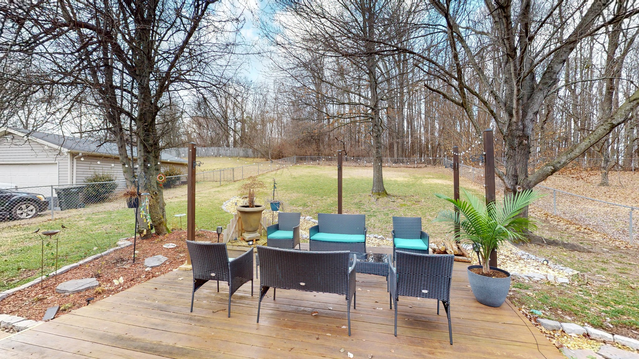209 Dockside Court Hermitage, TN 37076 - Photo 28 of 43 a view of a patio with a table chairs and a yard