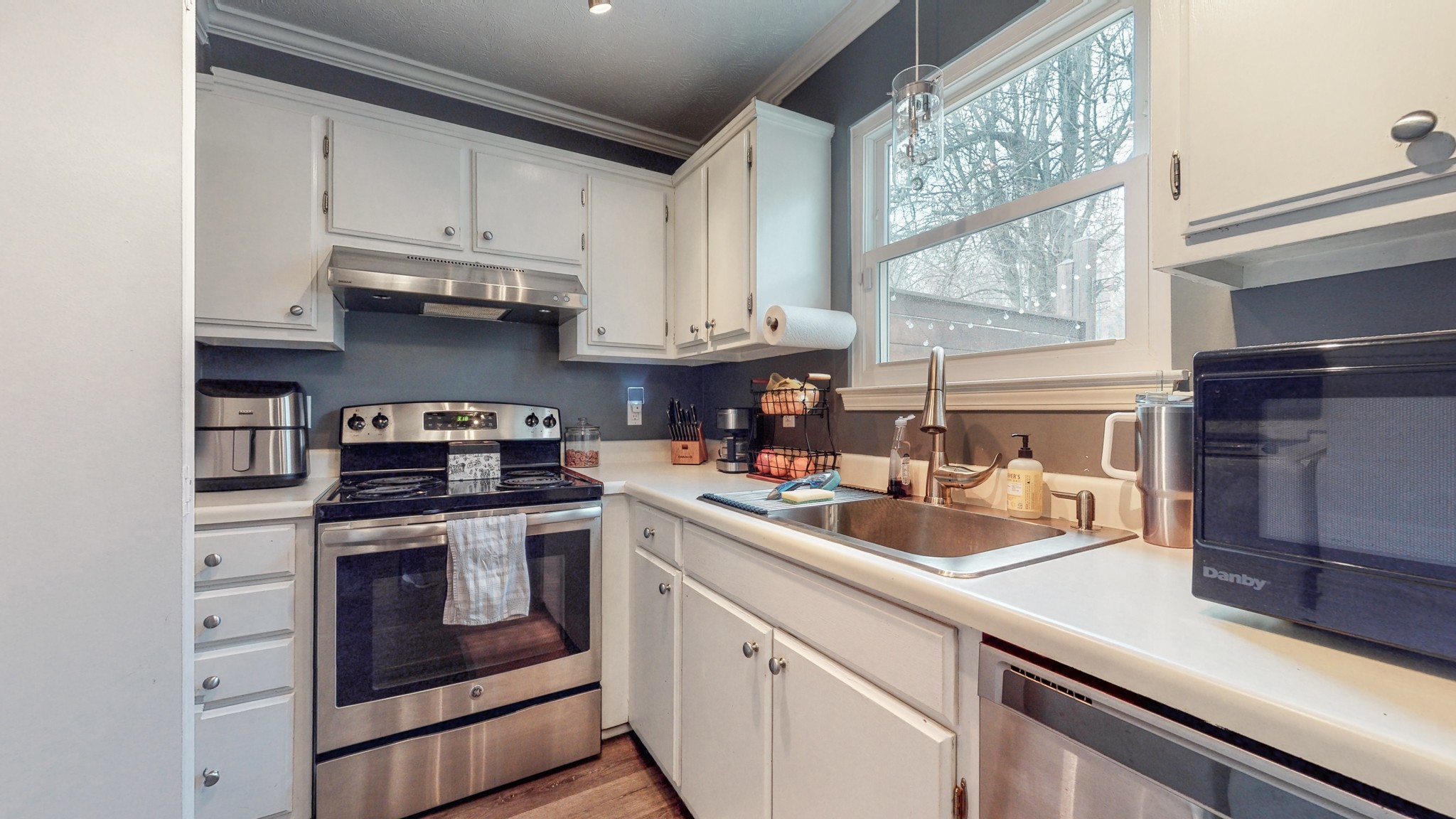 209 Dockside Court Hermitage, TN 37076 - Photo 6 of 43 a kitchen with stainless steel appliances granite countertop a sink a stove and a refrigerator