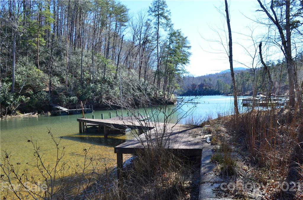 999 Parkway North Rd Mill Spring Mill Spring, NC 28756 - Photo 5 of 33 a view of a lake with a house in the background