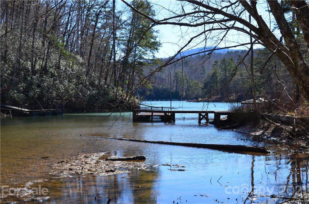 999 Parkway North Rd Mill Spring Mill Spring, NC 28756 - Photo 6 of 33 a view of a lake with a house