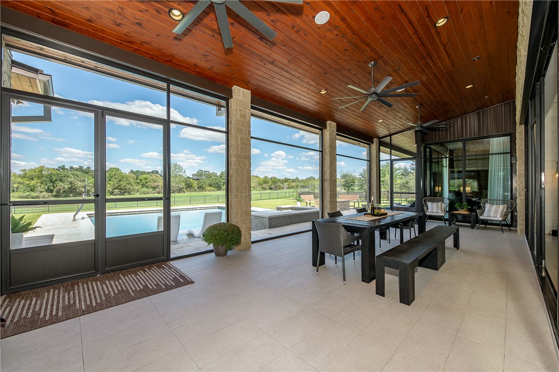 3320 Sycamore Trail Bryan, TX 77807 - Photo 26 of 49 Sunroom featuring outdoor dining space, a wealth of natural light, and ceiling fan