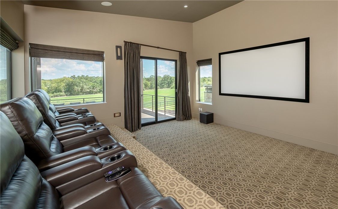 3320 Sycamore Trail Bryan, TX 77807 - Photo 37 of 49 Home theater with carpet floors, baseboards, vaulted ceiling, and recessed lighting