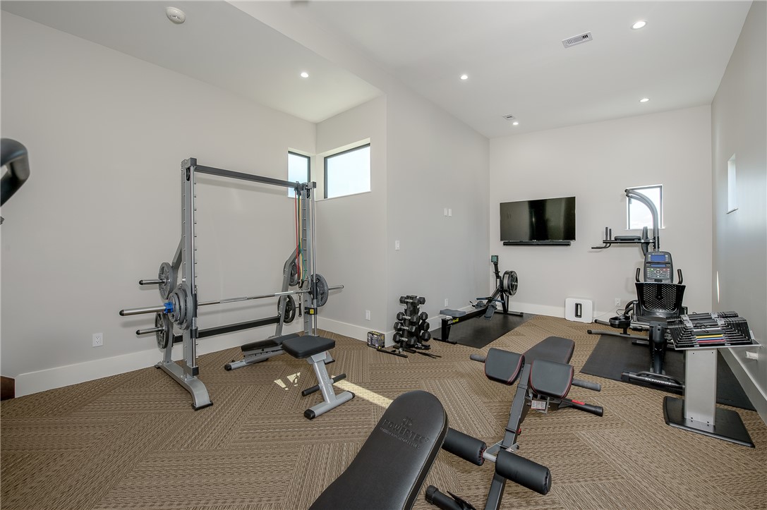3320 Sycamore Trail Bryan, TX 77807 - Photo 46 of 49 Exercise room with visible vents, baseboards, and recessed lighting
