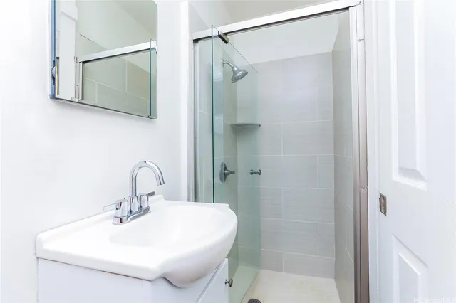 a bathroom with a sink and mirror