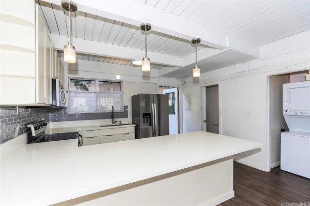 a large kitchen with stainless steel appliances kitchen island a large island in the center