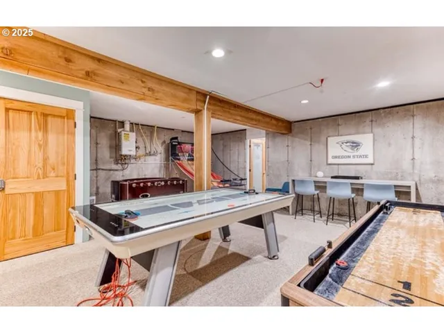 a living room with furniture a dining table and chairs