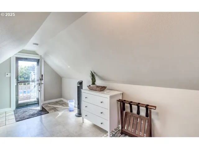 a kitchen view with cabinets and wooden floor