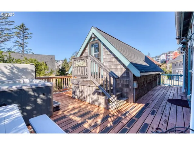 a view of a deck with wooden floor and seating space