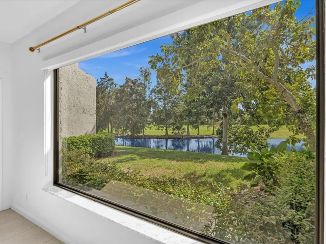 a view of a pool with a yard