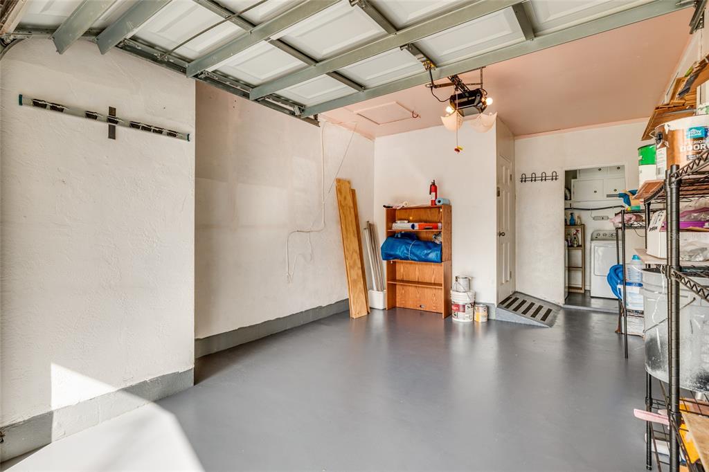 13877 94th Avenue North Seminole, FL 33776 - Photo 22 of 44 an empty room with wooden floor and a ceiling fan