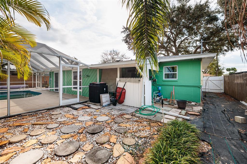 13877 94th Avenue North Seminole, FL 33776 - Photo 24 of 44 a front view of a house with garden