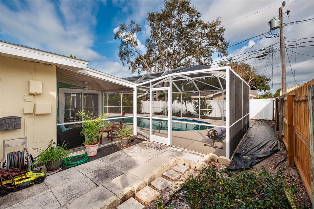 13877 94th Avenue North Seminole, FL 33776 - Photo 25 of 44 a house view with a backyard space