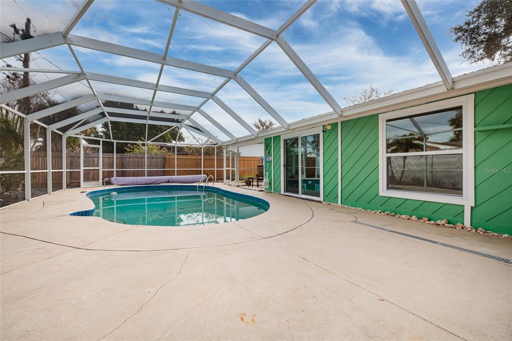 13877 94th Avenue North Seminole, FL 33776 - Photo 27 of 44 a view of a swimming pool with a porch
