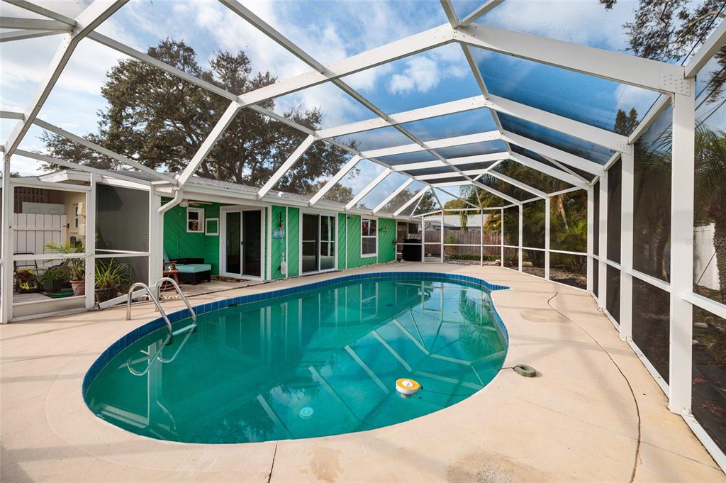 13877 94th Avenue North Seminole, FL 33776 - Photo 28 of 44 a view of a swimming pool with a patio