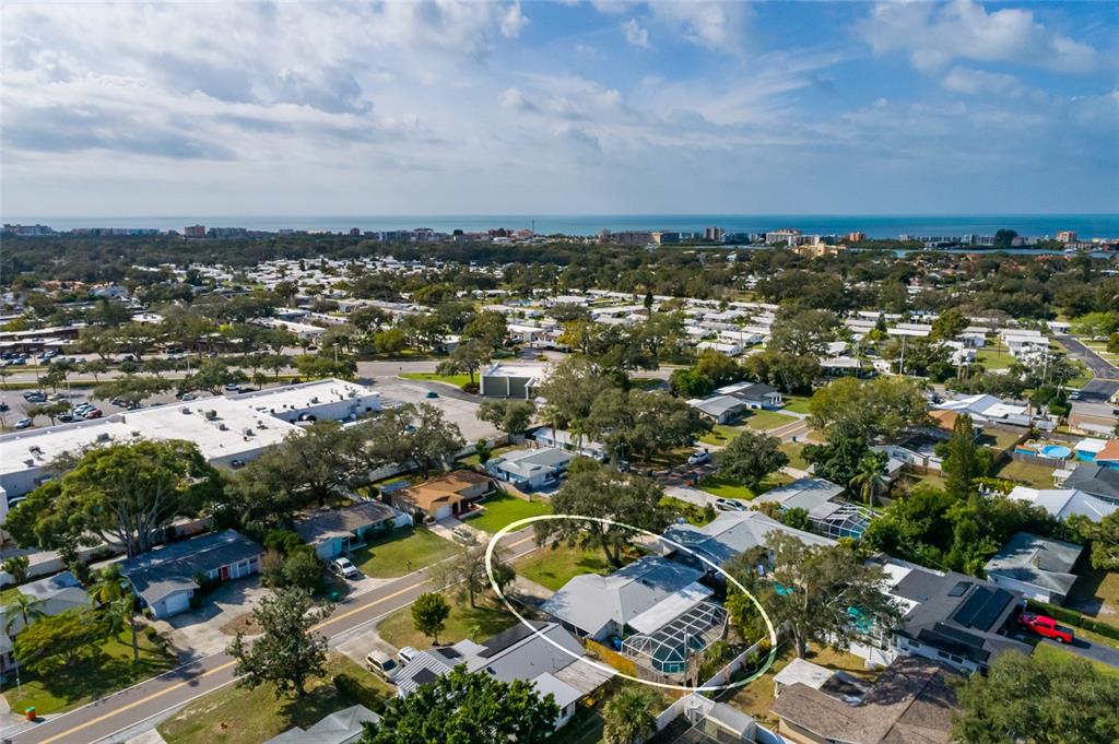 13877 94th Avenue North Seminole, FL 33776 - Photo 41 of 44 an aerial view of a city with lots of residential buildings