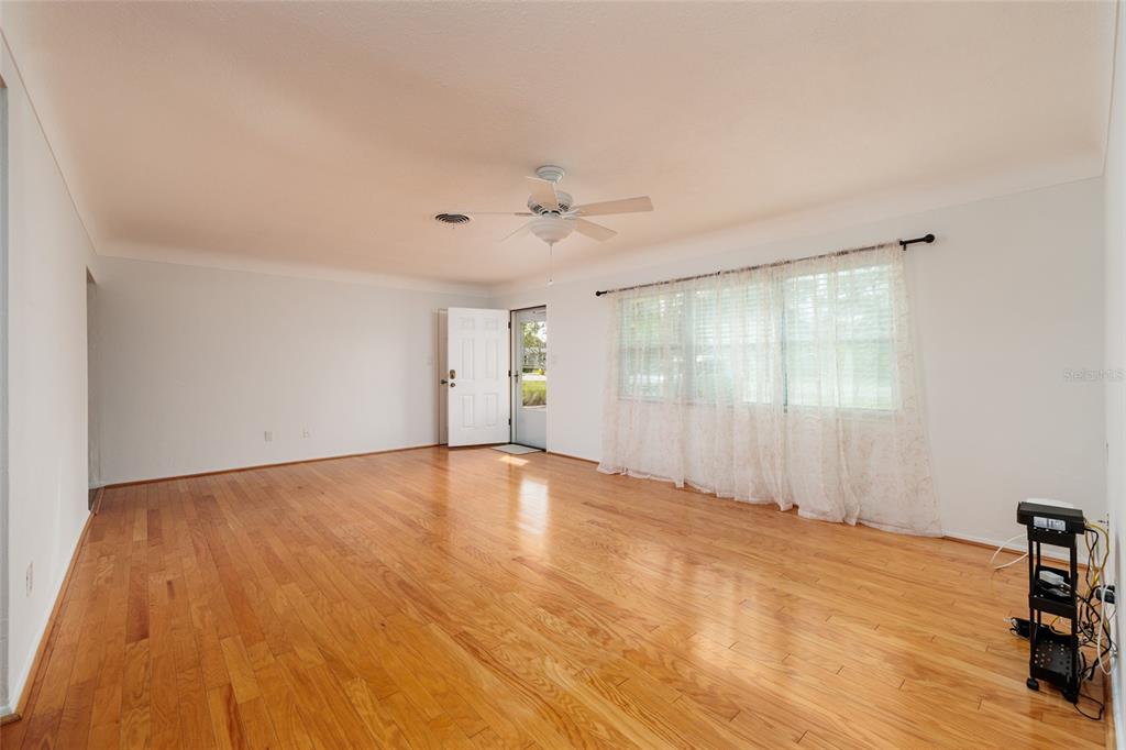 13877 94th Avenue North Seminole, FL 33776 - Photo 6 of 44 a view of an empty room with a window