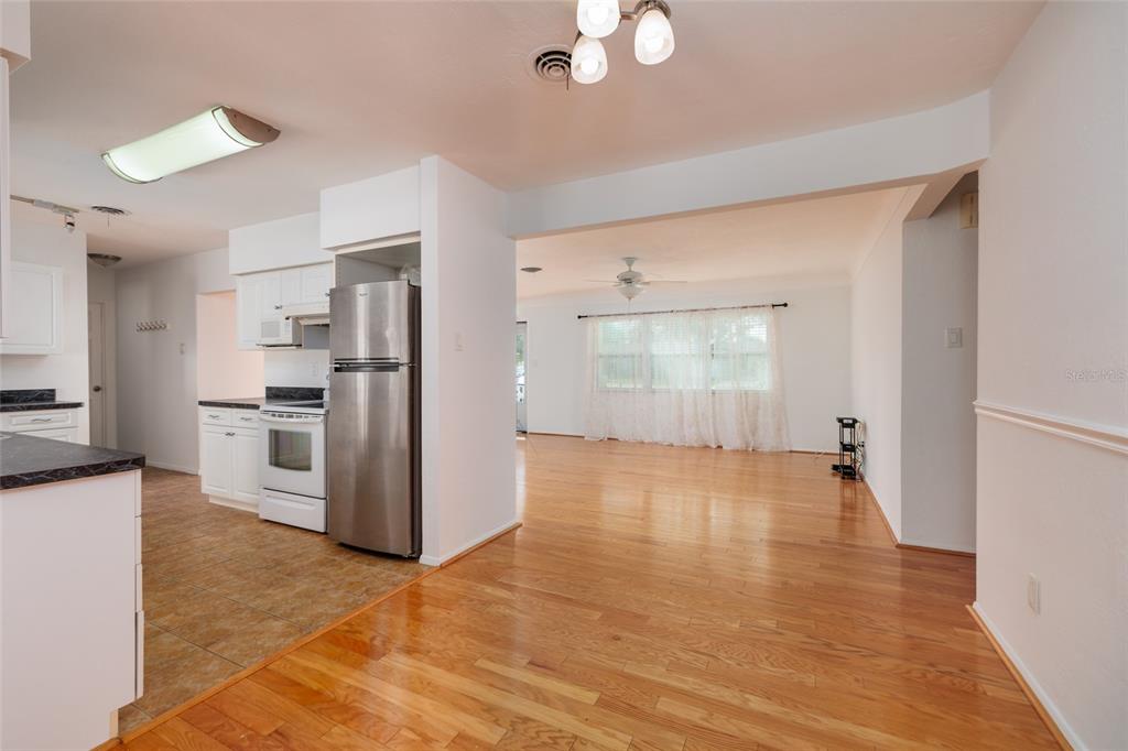 13877 94th Avenue North Seminole, FL 33776 - Photo 8 of 44 a view of a kitchen with refrigerator and window