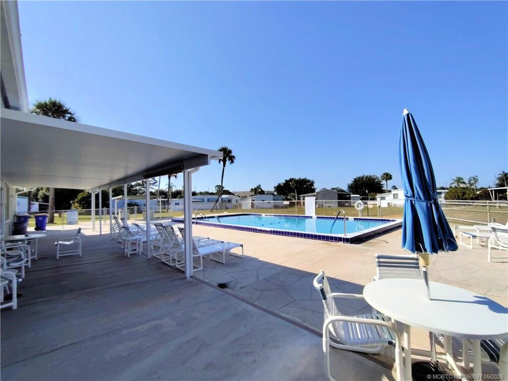 143 Southeast Easy Street Stuart, FL 34994 - Photo 10 of 12 a living room with chairs