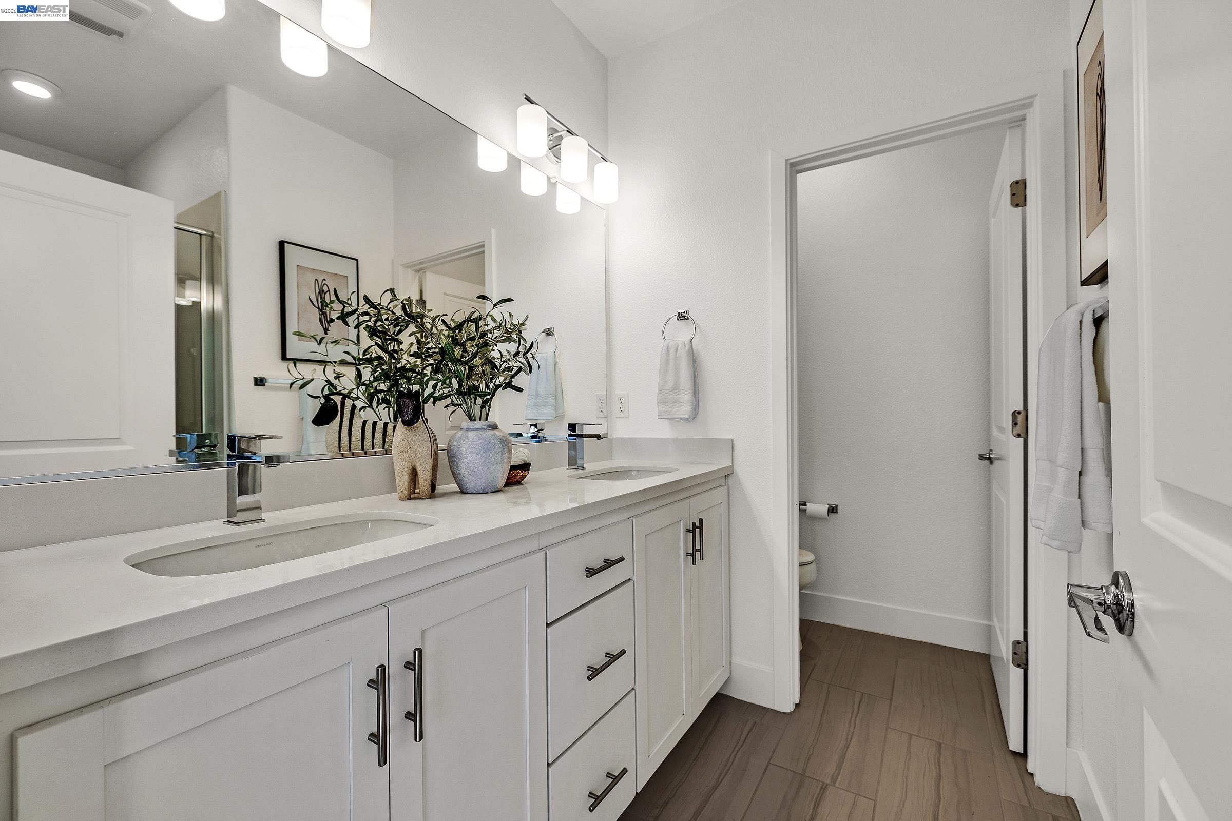 29259 Hub Court Hayward, CA 94544 - Photo 17 of 34 a bathroom with a double vanity sink mirror and shower