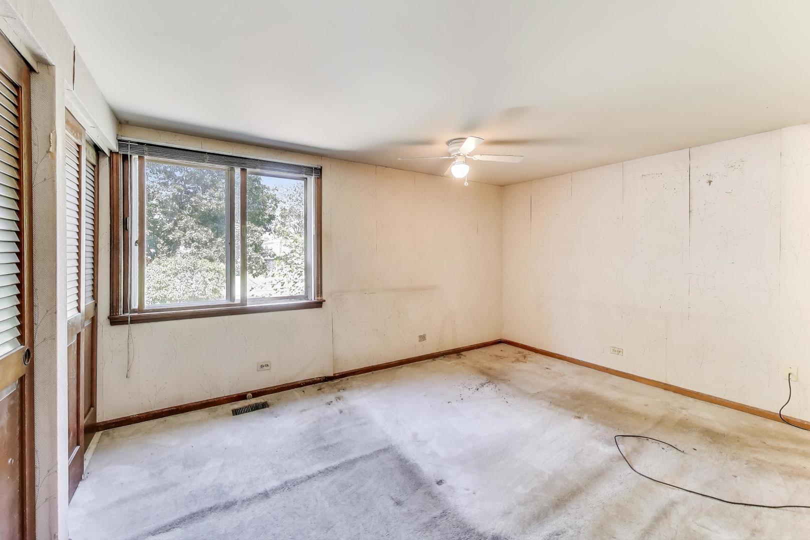 3509 Lawson Road Glenview, IL 60026 - Photo 19 of 54 an empty room with windows and fan