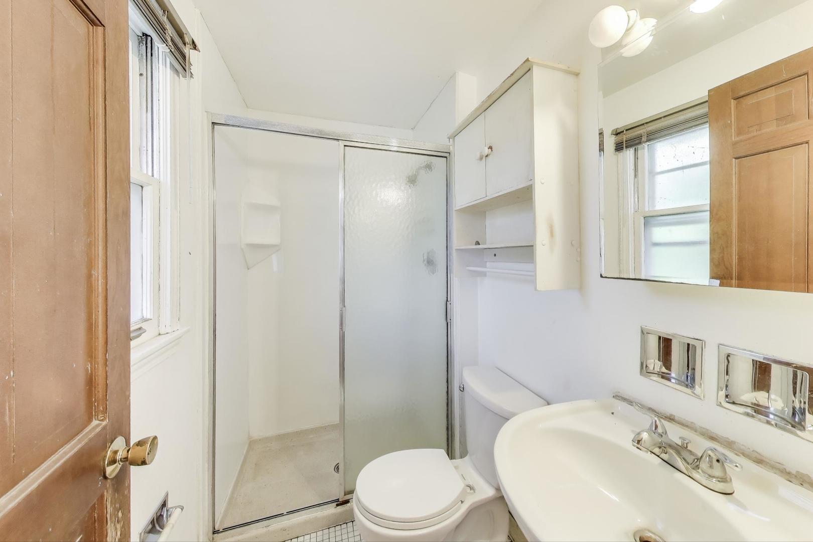 3509 Lawson Road Glenview, IL 60026 - Photo 20 of 54 a bathroom with a sink toilet and shower