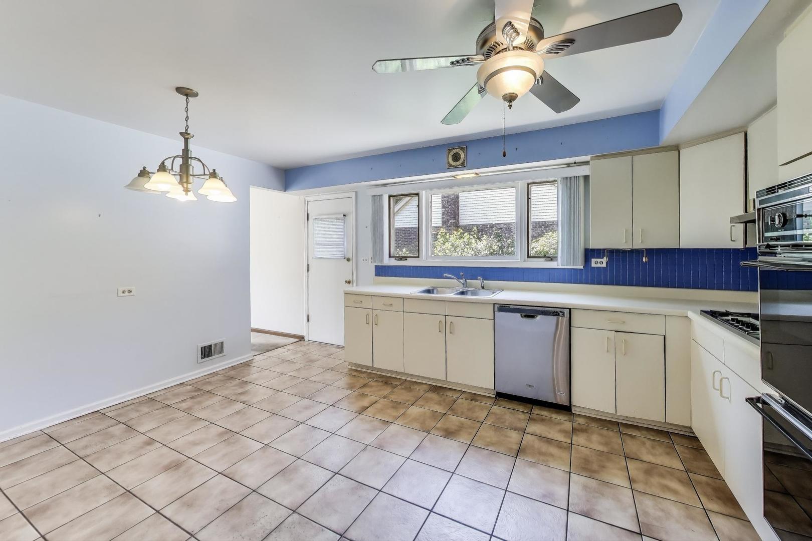 3509 Lawson Road Glenview, IL 60026 - Photo 5 of 54 a kitchen with a stove a sink and a refrigerator