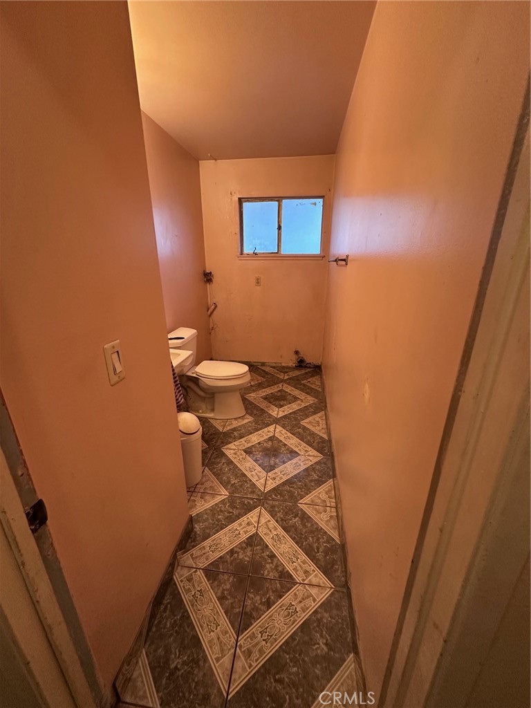 262 North Larch Avenue Rialto, CA 92376 - Photo 8 of 13 a bathroom with a sink and a mirror