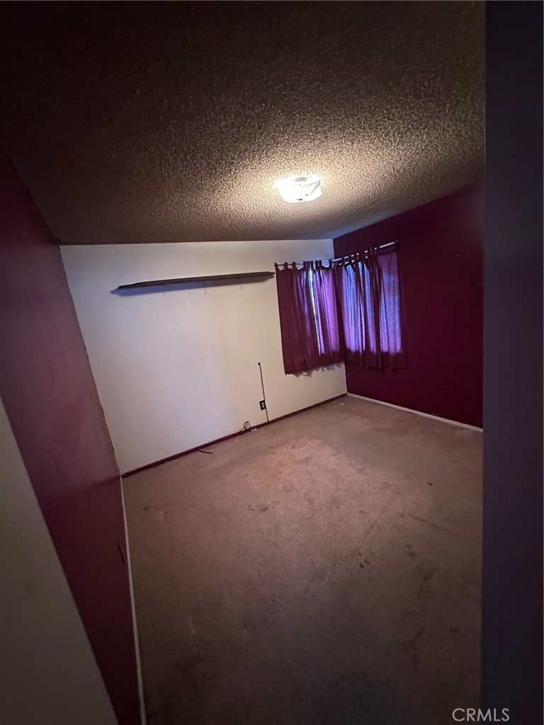 262 North Larch Avenue Rialto, CA 92376 - Photo 10 of 13 an empty room with windows