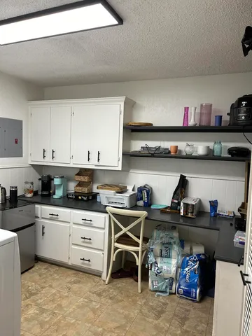 a kitchen with stainless steel appliances granite countertop a stove and cabinets