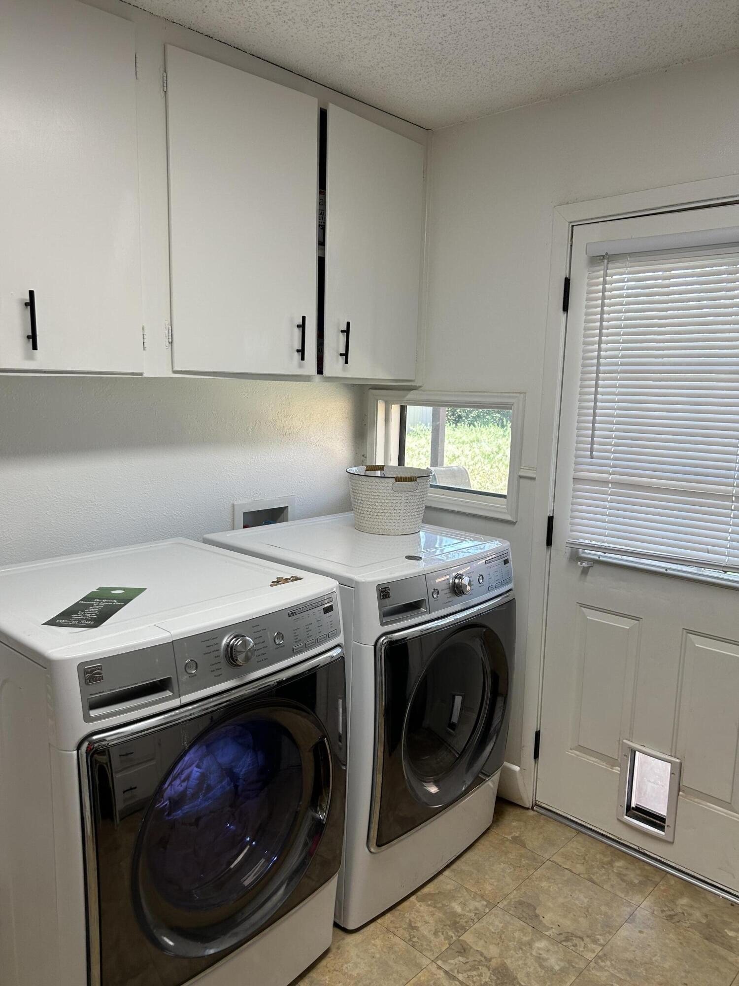 4809 8th Street Lubbock, TX 79416 - Photo 14 of 14 a utility room with dryer and washer