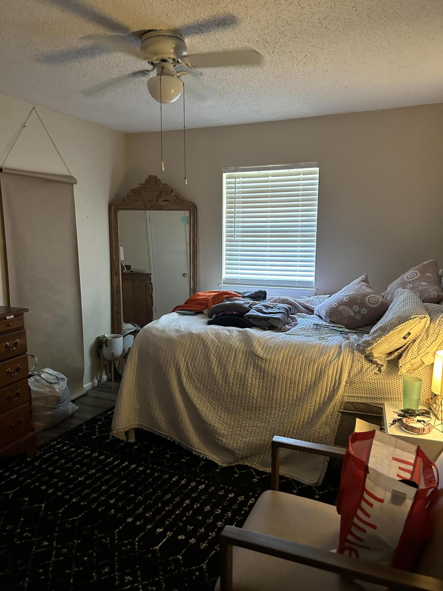 4809 8th Street Lubbock, TX 79416 - Photo 7 of 14 a bedroom with a bed and a window