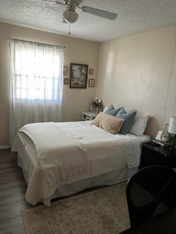 a bedroom with a bed and window