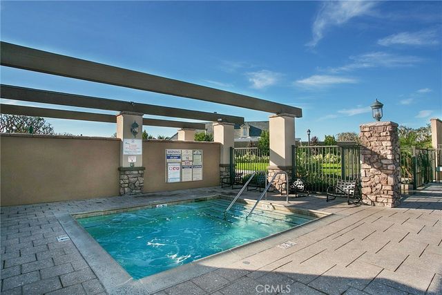 an outdoor view of a garden with furniture
