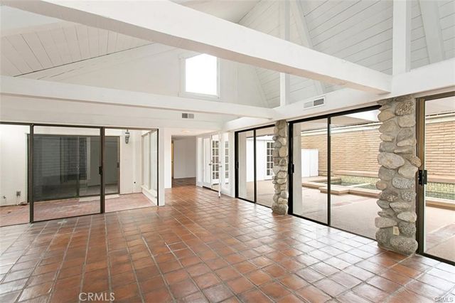 a view of an entryway with an empty room