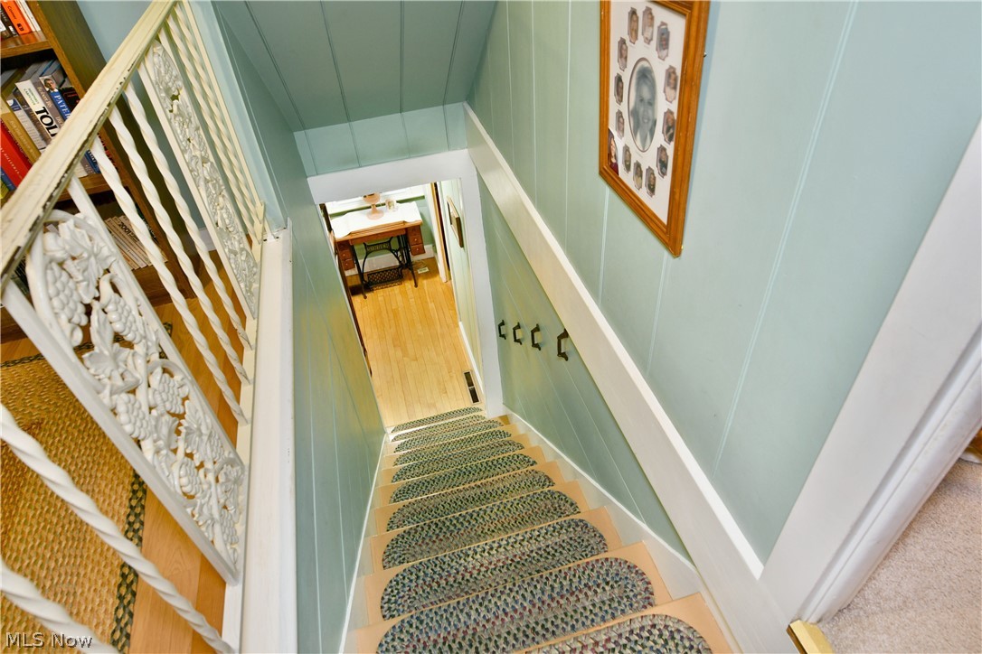 8683 King Graves Road Northeast Warren, OH 44484 - Photo 28 of 50 Stairway featuring carved white wooden balusters and light blue paneling