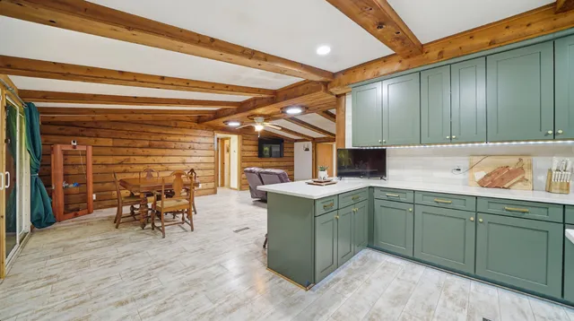 a kitchen with a sink and wooden cabinets