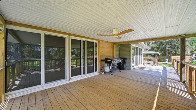 a view of a patio with wooden floor