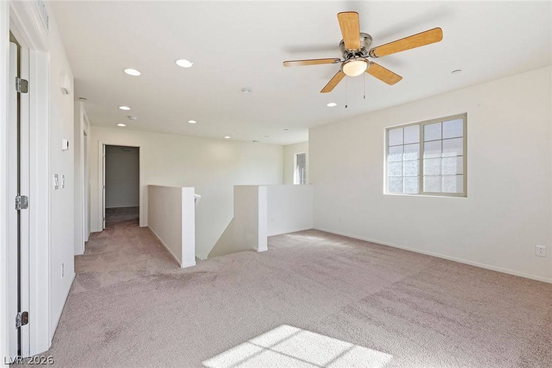 250 Dedication Avenue Henderson, NV 89011 - Photo 27 of 67 Spare room with light carpet, recessed lighting, and a ceiling fan