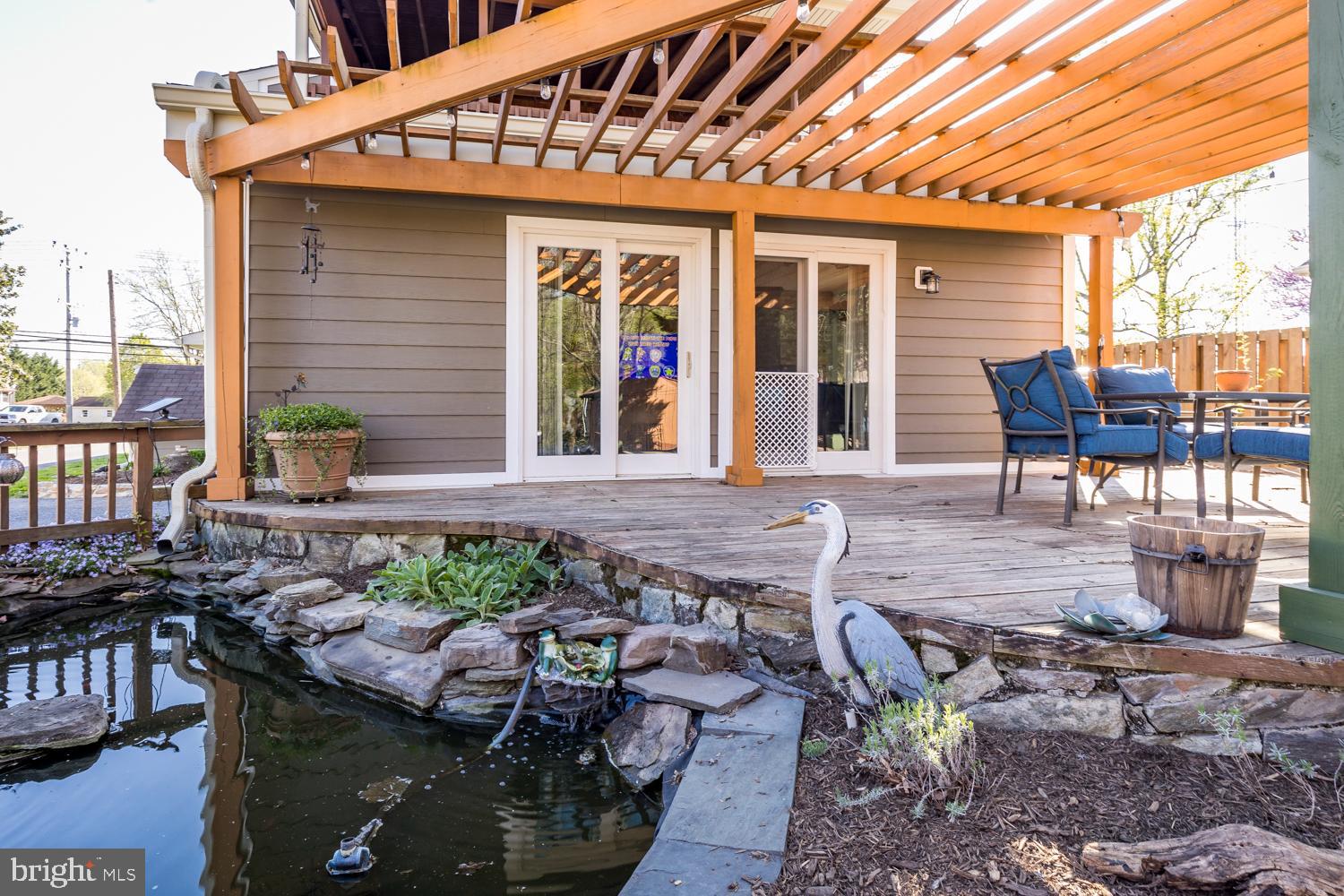 10516 Scaggsville Road Laurel, MD 20723 - Photo 54 of 68 Deck with pergola and koi pond