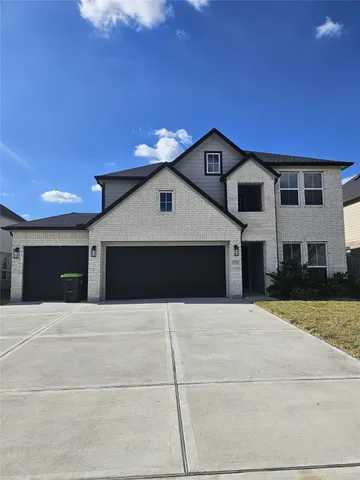 a front view of a house with yard