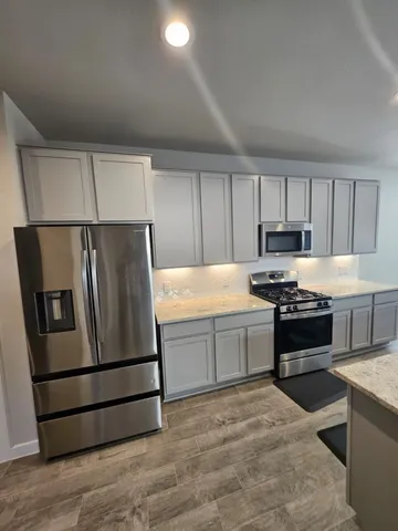 a view of a dining room with furniture and window