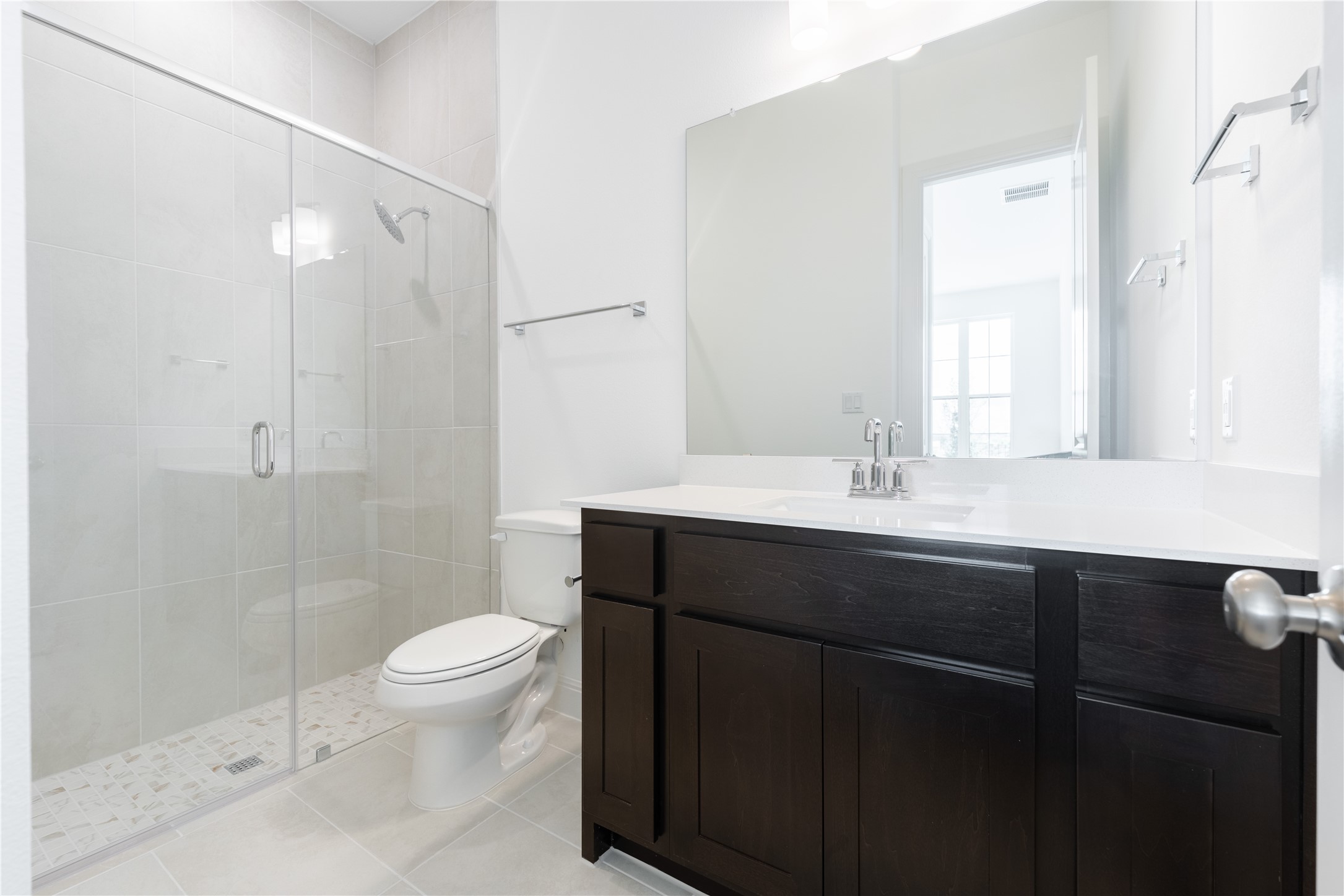 905 South Hemingway Loop Liberty Hill, TX 78642 - Photo 19 of 35 a bathroom with a sink a toilet a shower and a mirror