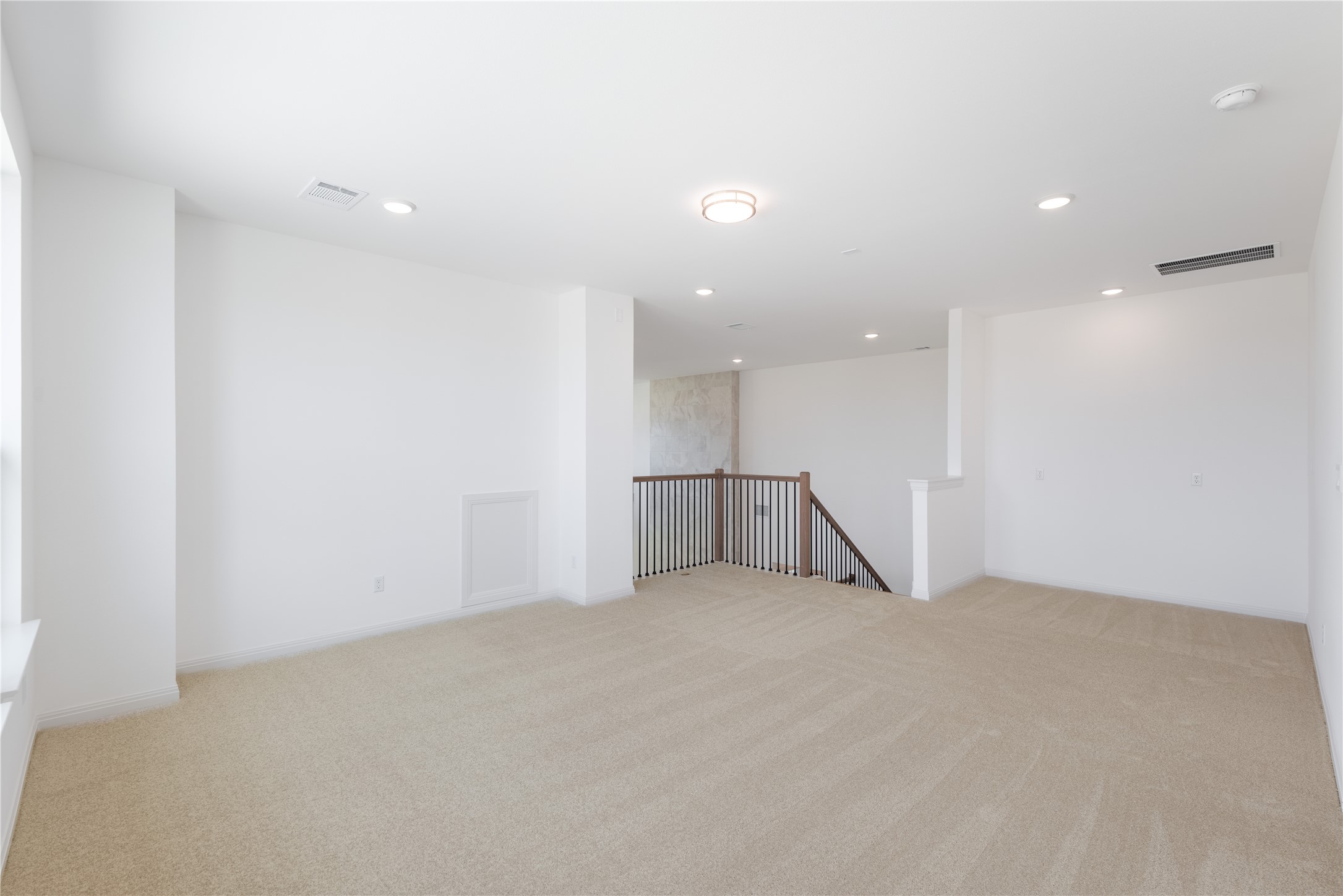 905 South Hemingway Loop Liberty Hill, TX 78642 - Photo 22 of 35 an empty room with a kitchen space and a window