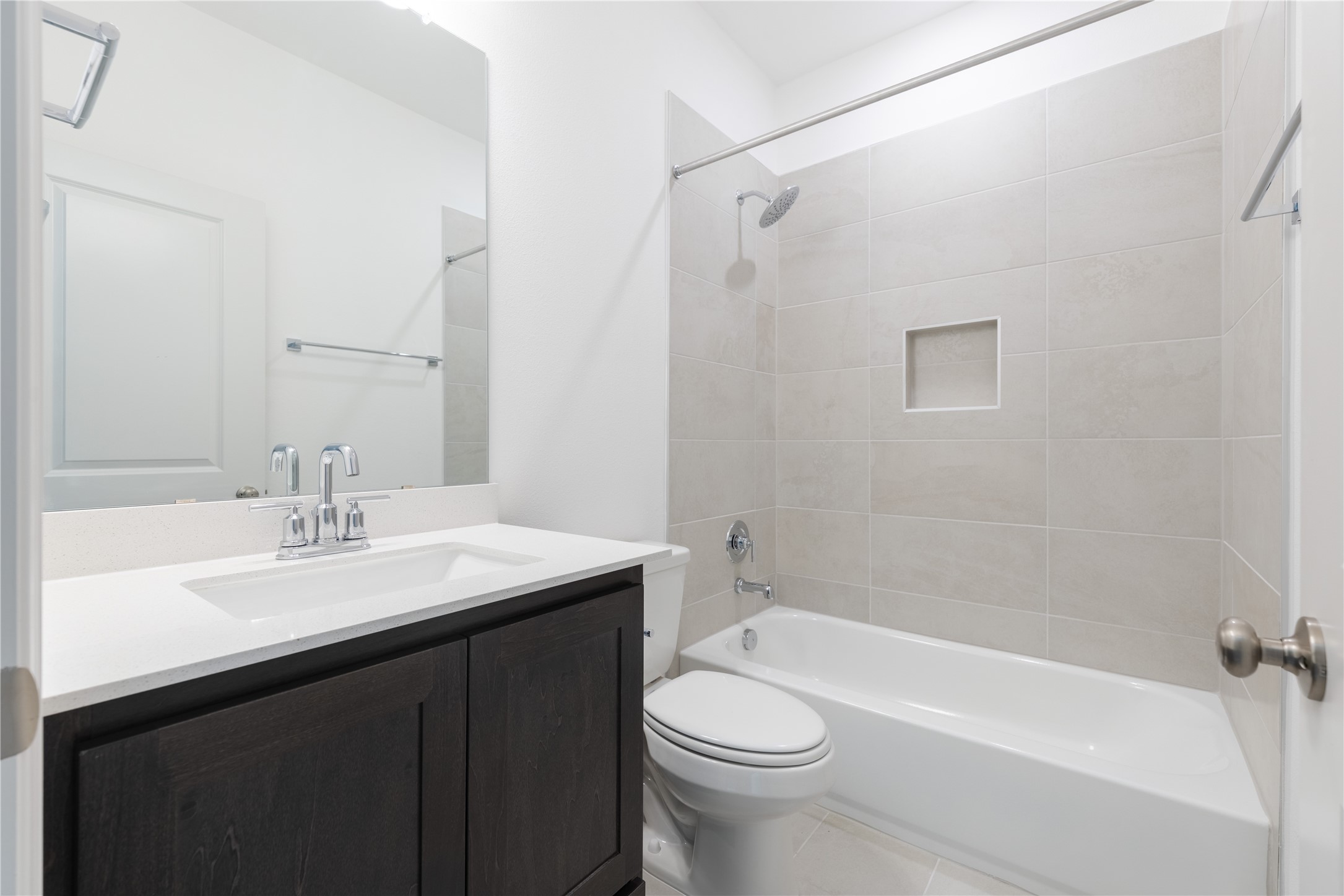 905 South Hemingway Loop Liberty Hill, TX 78642 - Photo 24 of 35 a bathroom with a sink a toilet and shower