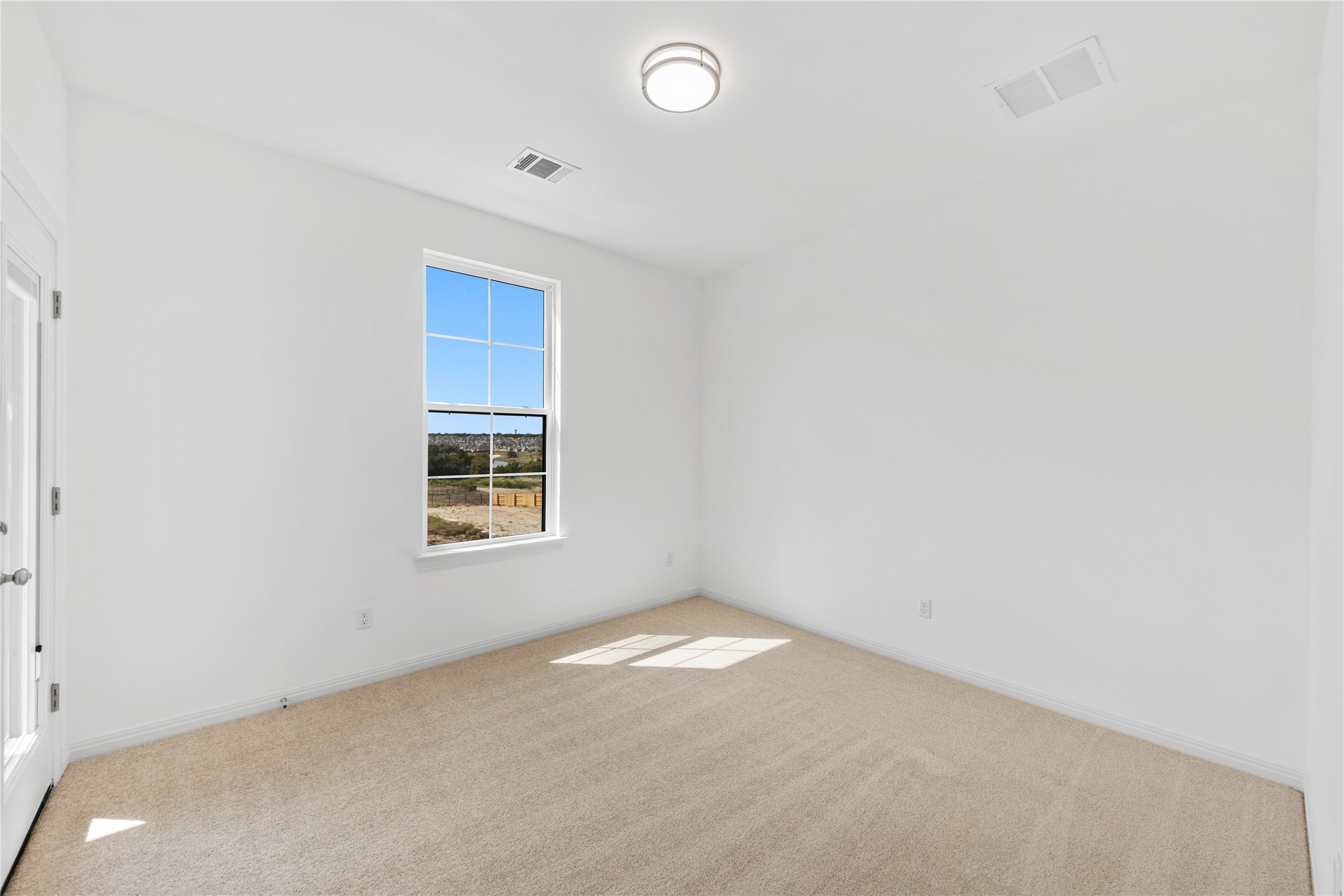 905 South Hemingway Loop Liberty Hill, TX 78642 - Photo 25 of 35 an empty room with a window
