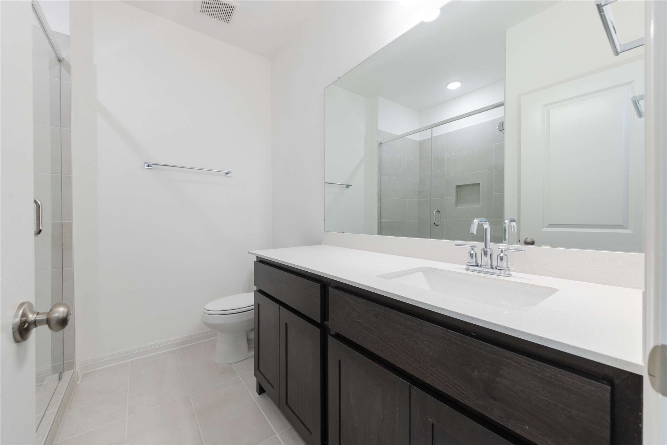905 South Hemingway Loop Liberty Hill, TX 78642 - Photo 26 of 35 a bathroom with a sink a toilet and a mirror
