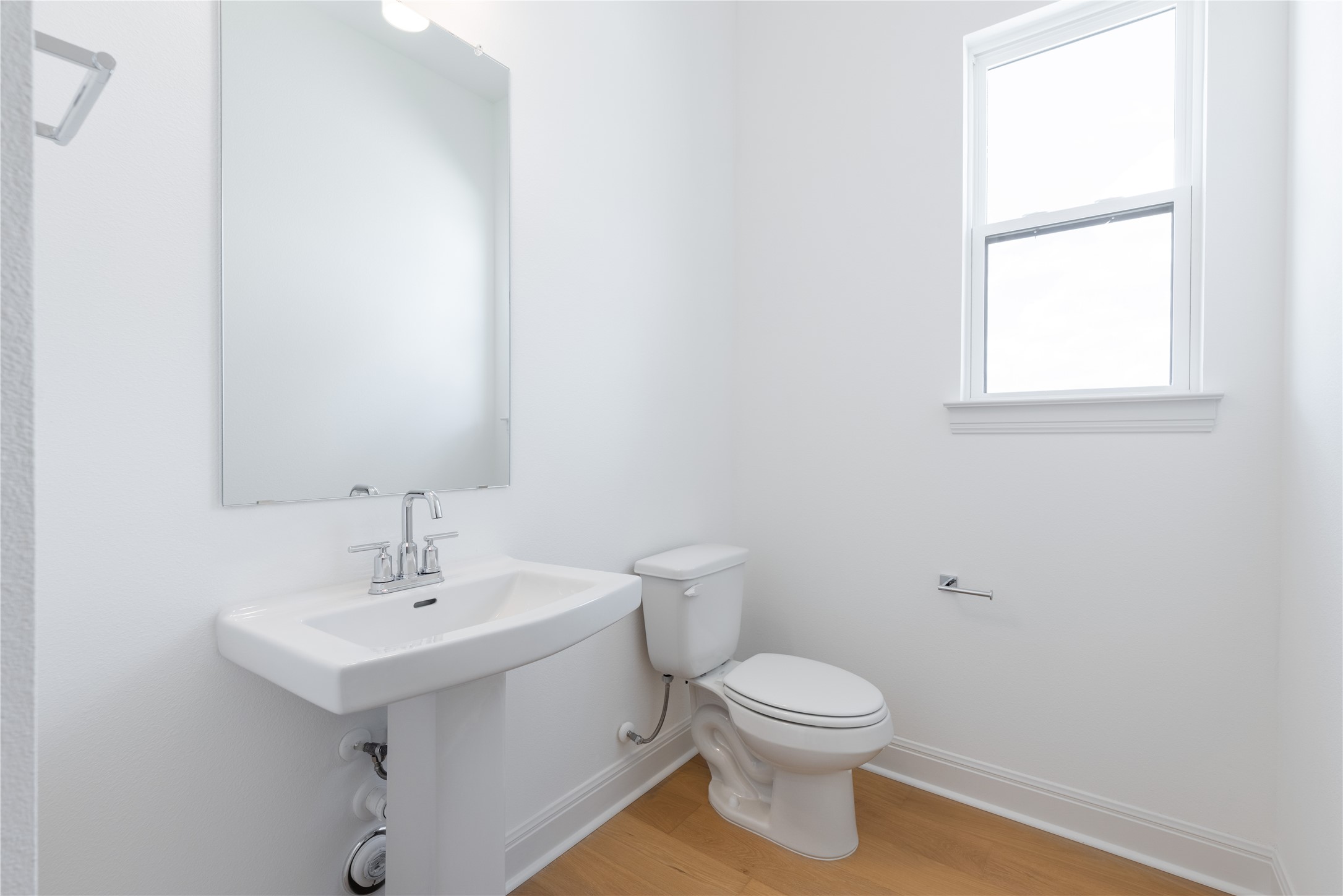 905 South Hemingway Loop Liberty Hill, TX 78642 - Photo 30 of 35 a bathroom with a toilet a sink and a window
