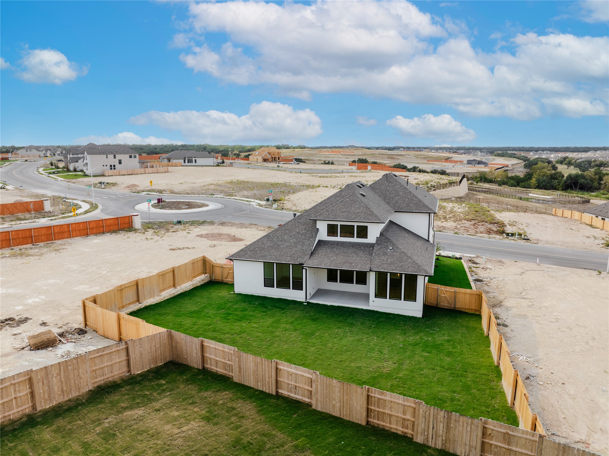 905 South Hemingway Loop Liberty Hill, TX 78642 - Photo 34 of 35 an aerial view of a house with swimming pool garden and mountain view in back