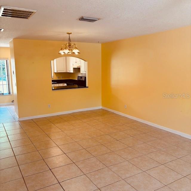 925 East Rembrandt Way, Unit 104 Inverness, FL 34453 - Photo 11 of 36 a view of a livingroom with a chandelier